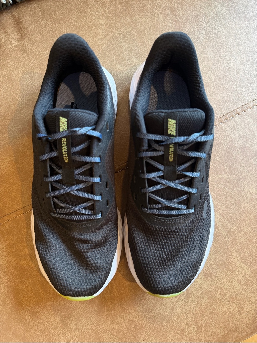 Nike Black Athletic Shoes with Yellow Toe Accents